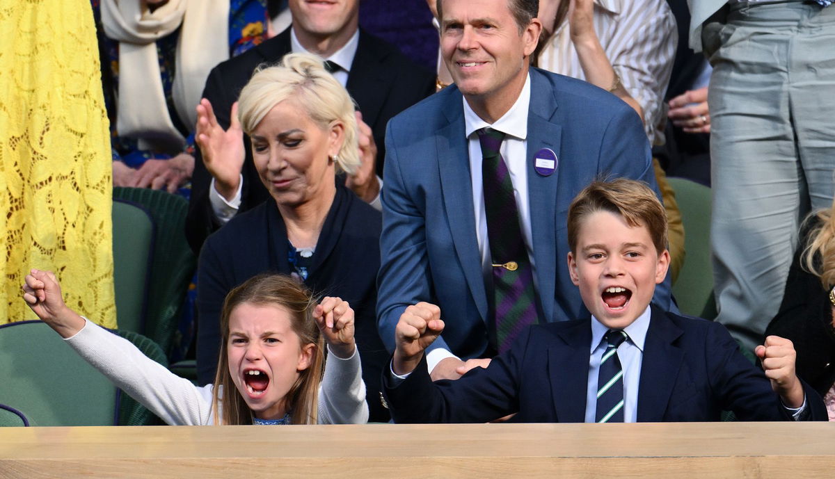 <i>Karwai Tang/WireImage/Getty Images</i><br/>Charlotte and George cheer emphatically as they watch the epic men's finale of the prestigious tennis tournament.