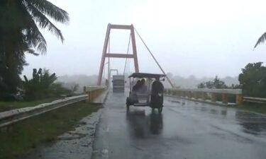 Vehicles battle harsh gusts along a bridge in Cagayan province