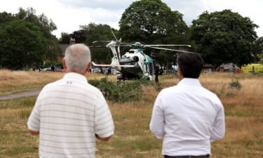 An air ambulance lands on Wimbledon Common in response to the incident.