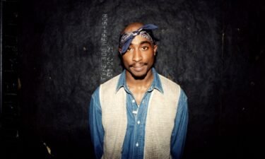 Tupac Shakur poses for photos backstage after his performance at the Regal Theater in Chicago