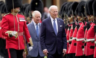 U.S. President Joe Biden and Britain's King Charles review an honorary guard at Windsor Castle in Windsor