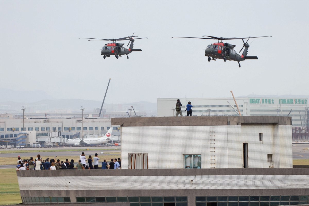 Black Hawk helicopters prepare to land at Taoyuan International Airport as part of the annual Han Kuang military exercise on July 26.