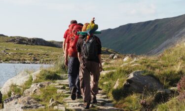 Mountain rescue were called out to help a woman who was on a hike with her pet parrot.