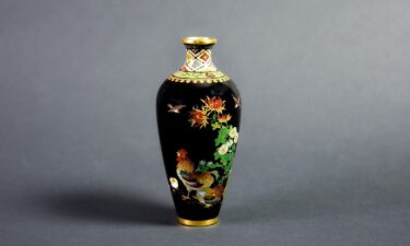 A hand-sized vase bought from a UK thrift store for just £2.50 ($3.30) is expected to sell for up to £9