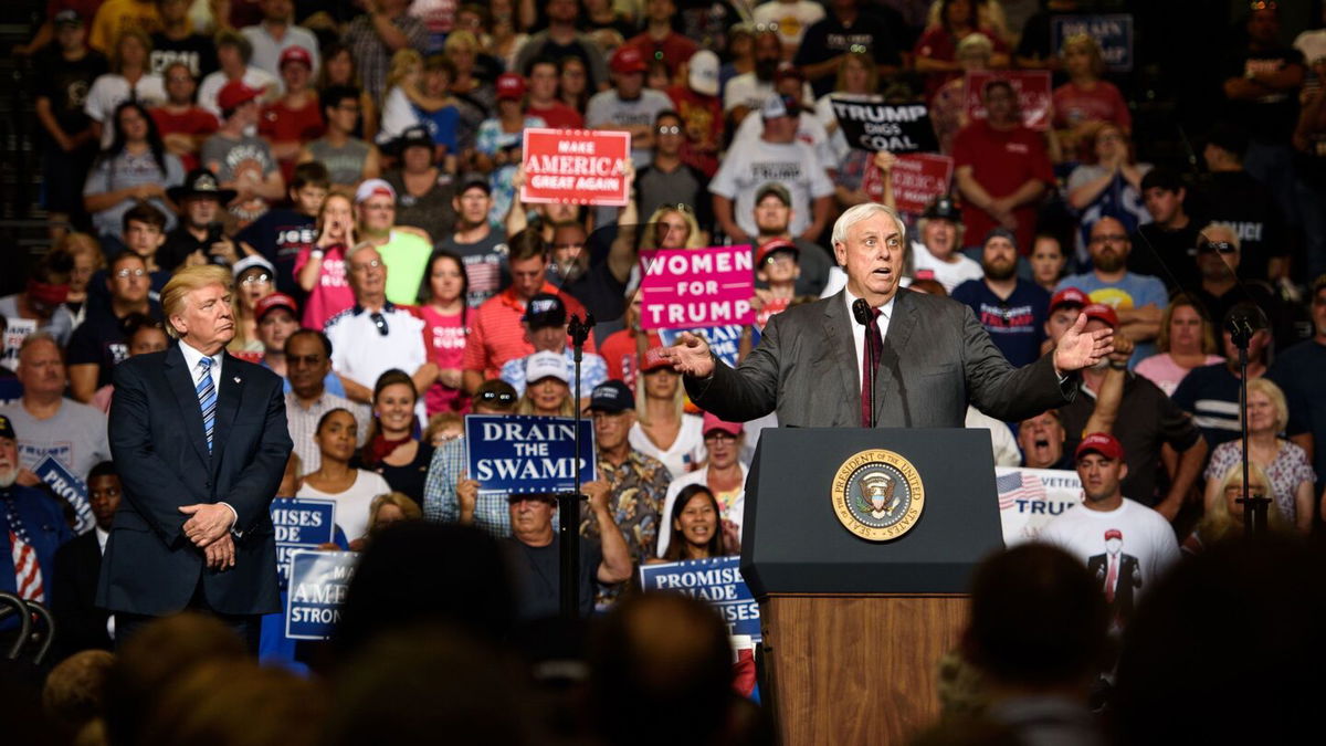 <i>Justin Merriman/Getty Images</i><br/>West Virginia Governor Jim Justice announces in August 2017 that he is switching parties to become a Republican as then-President Donald Trump listens at a campaign rally in Huntington