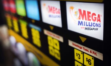 A lottery ticket vending machine offers Mega Millions tickets for sale on January 9