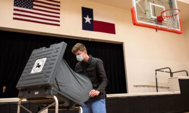 An election clerk sets up a voting machine on Election Day in Houston in November 2020.