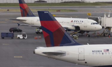 Federal officials are investigating a Delta Air Lines flight that taxied around the Las Vegas airport for nearly 90 minutes on Monday in triple-digit temperatures.