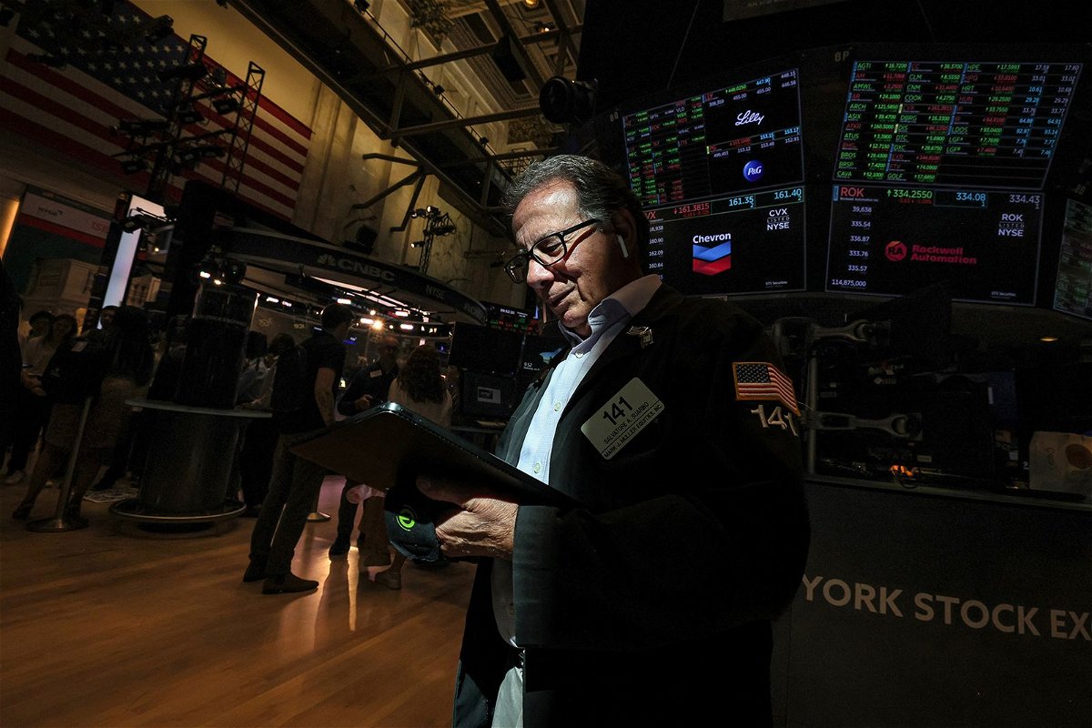 Traders work on the floor of the New York Stock Exchange (NYSE) in New York City, July 26.