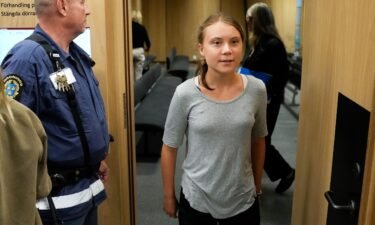 Climate activist Greta Thunberg leaves a court room after a hearing in Malmö
