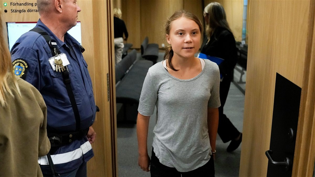 Climate activist Greta Thunberg leaves a court room after a hearing in Malmö