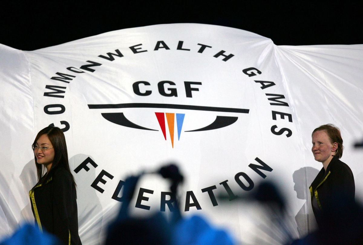 <i>Mark Baker/AP/FILE</i><br/>The Commonwealth Games Federation flag is carried into the arena during the Games opening ceremony in Melbourne