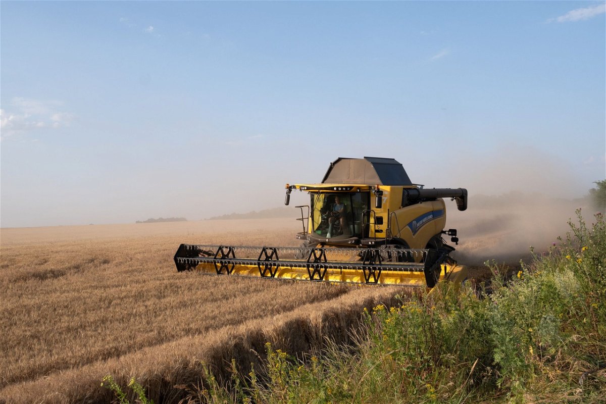 <i>Amadeusz Swierk/Anadolu Agency/Getty Images</i><br/>Harvester works on a wheat fields near ongoing Ukrainian counter-offensive in Prymorske