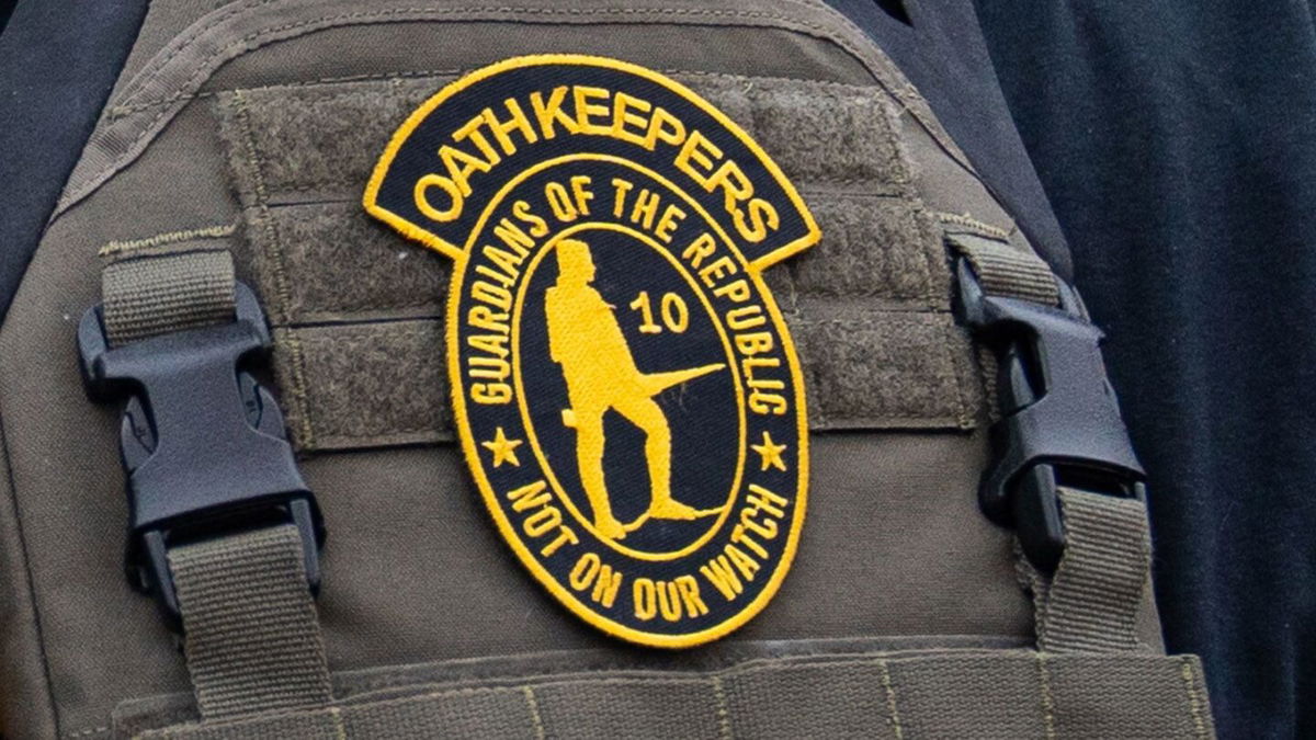 <i>Robert Nickelsberg/Getty Images/FILE</i><br/>A member of the right-wing group Oath Keepers stands guard during a rally in front of the U.S. Supreme Court Building on January 5