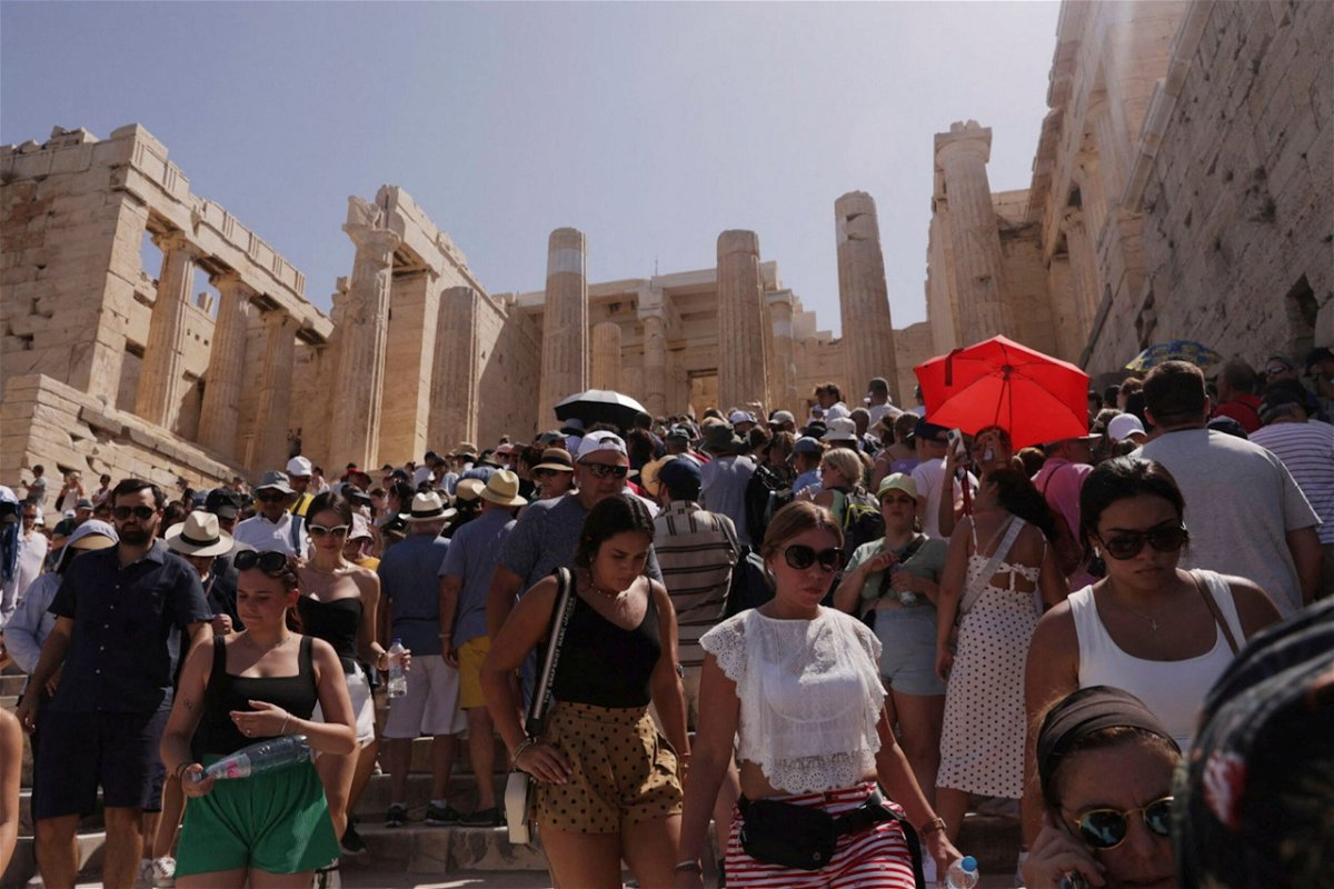 <i>Louiza Vradi/Reuters</i><br/>Visitors walk in front of the Acropolis' Propylaea