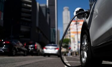 An electric vehicle is plugged into a charger in Los Angeles