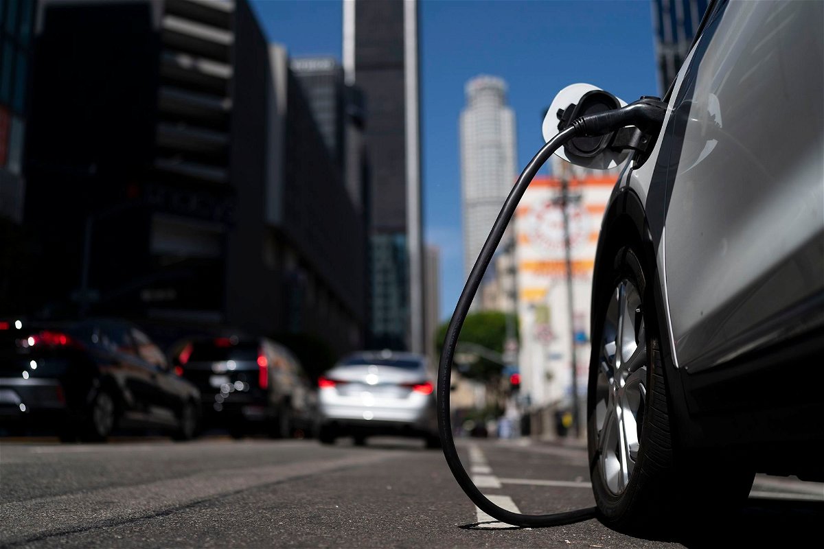 <i>Jae C. Hong/AP</i><br/>An electric vehicle is plugged into a charger in Los Angeles