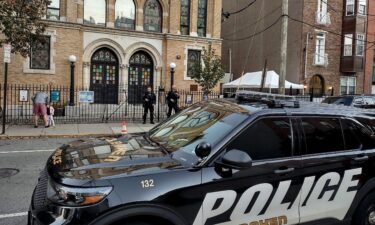 Police officers are pictured outside the United Synagogue of Hoboken