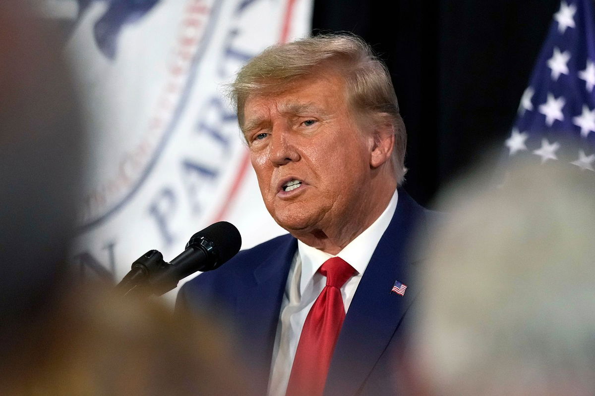 <i>Charlie Neibergall/AP</i><br/>Former President Donald Trump visits with campaign volunteers at the Elks Lodge on July 18 in Cedar Rapids