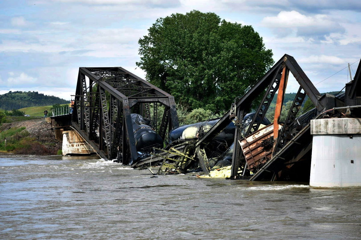 <i>Matthew Brown/AP</i><br/>Several train cars fell in the Yellowstone River after a bridge collapse near Columbus on Saturday
