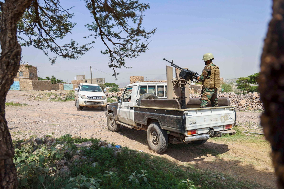 <i>Ahmad Al-Basha/AFP/Getty Images</i><br/>Members of security forces perform a search operation following the killing of a World Food Program (WFP) staffer a day earlier in Yemen's city of Turbah on July 22.