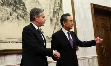 U.S. Secretary of State Antony Blinken shakes hands with China's Director of the Office of the Central Foreign Affairs Commission Wang Yi at the Diaoyutai State Guesthouse in Beijing