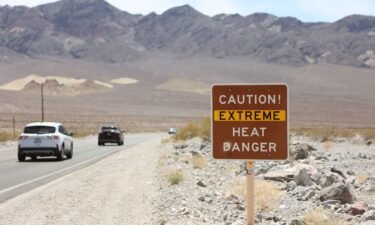 A heat advisory sign is shown along Highway 190 during a heat wave in Death Valley National Park in Death Valley