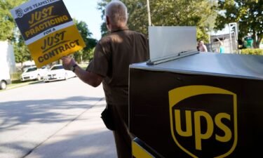 UPS workers go through a rehearsal of a pending strike at the UPS facility in Longwood