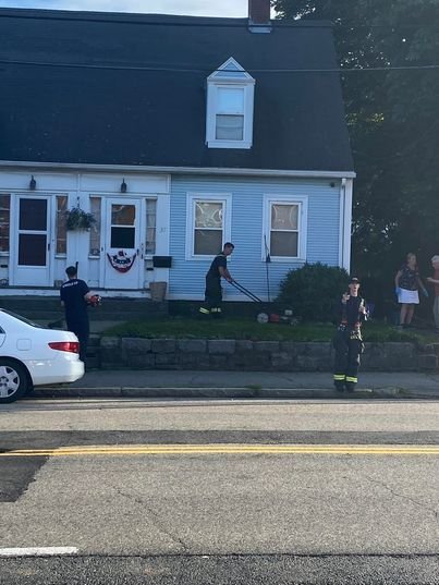 <i>Friends Of Quincy Firefighters IAFF Local 792/WBZ</i><br/>A fire crew in Quincy helped out an elderly man mow his lawn after he was struggling to tackle the chore on Tuesday.