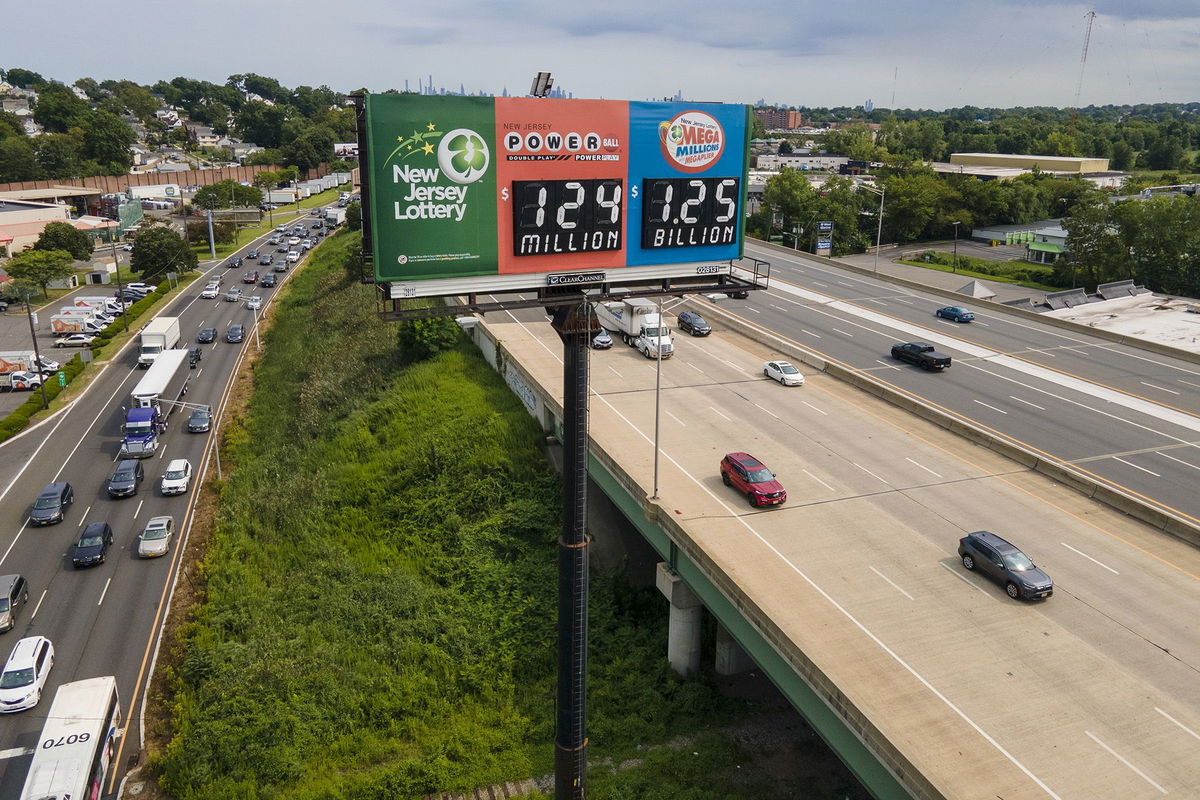 A billboard over Interstate 80 in New Jersey promotes a Mega Millions lottery jackpot of $1.25 billion.