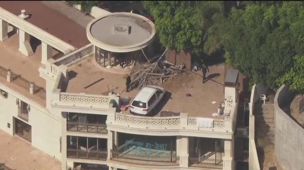 <i>KCAL</i><br/>A multimillion-dollar mansion in the Hollywood Hills was vandalized Thursday by what police say was a group of squatters.