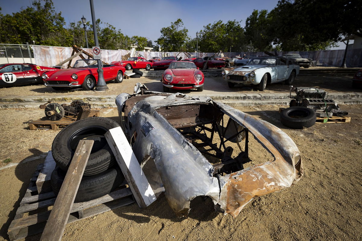 The 1945 Ferrari 500 Mondial Spider exhibited in a faux junkyard setting ahead of RM Sotheby's Monterey auction.