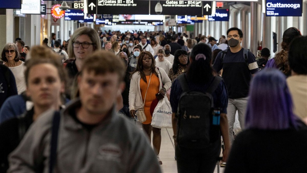 Passengers walk through a crowded Hartsfield-Jackson Atlanta International Airport on September 3, 2022. You can expect airports to be packed again for Labor Day weekend 2023.