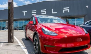 A Tesla Model Y is seen on a Tesla car lot.