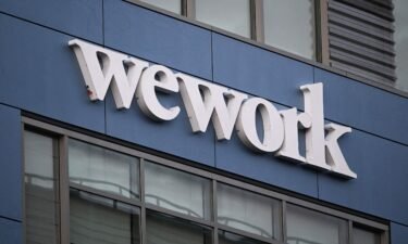 The WeWork logo is displayed outside of a shared commercial office space building in Los Angeles