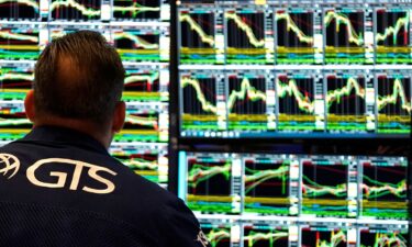 A trader works the floor of the New York Stock Exchange at the opening bell