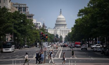 Pedestrians cross a street near the U.S. Capitol in Washington