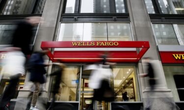 People walk past a Wells Fargo branch on January 10
