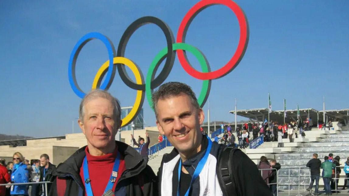 Jeff Kolkmann, pictured with his friend Sergei Banthle at the Winter Olympics in Sochi, Russia, has attended 17 Olympic Games over the years.