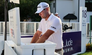 Cantlay shakes hands with Glover (right) after the playoff.