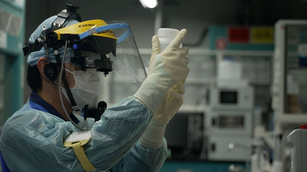 A TEPCO researcher assesses the radiation impact of treated wastewater in Fukushima, Japan, on April 12.