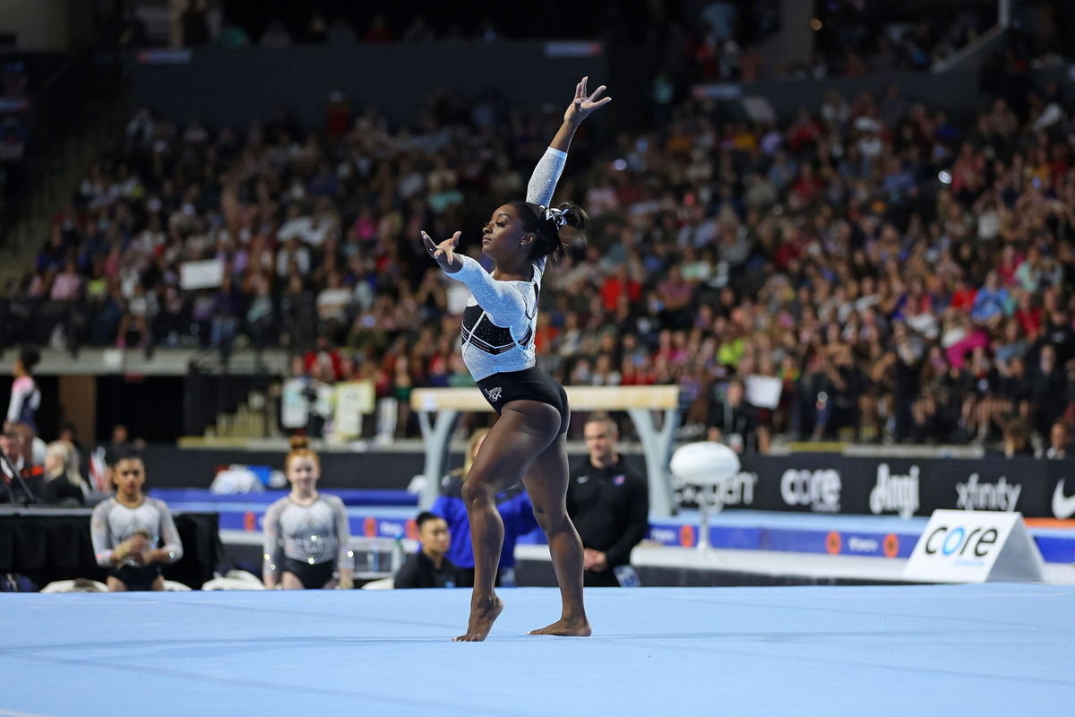 <i>Stacy Revere/Getty Images</i><br/>Simone Biles celebrates after winning the all-around competition at the Core Hydration Classic.