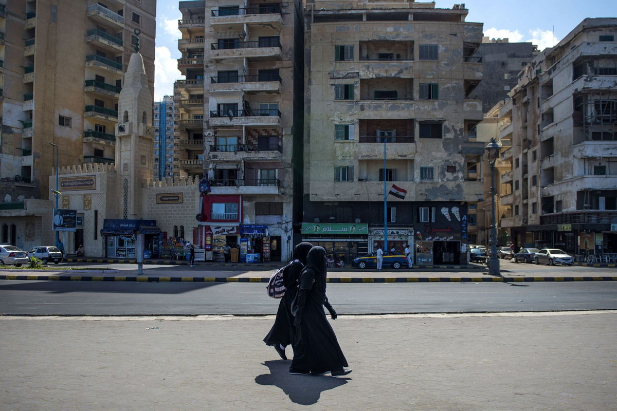 <i>Mohamed Hossam/EPA-EFE/Shutterstock</i><br/>Two women walk by the corniche in Alexandria