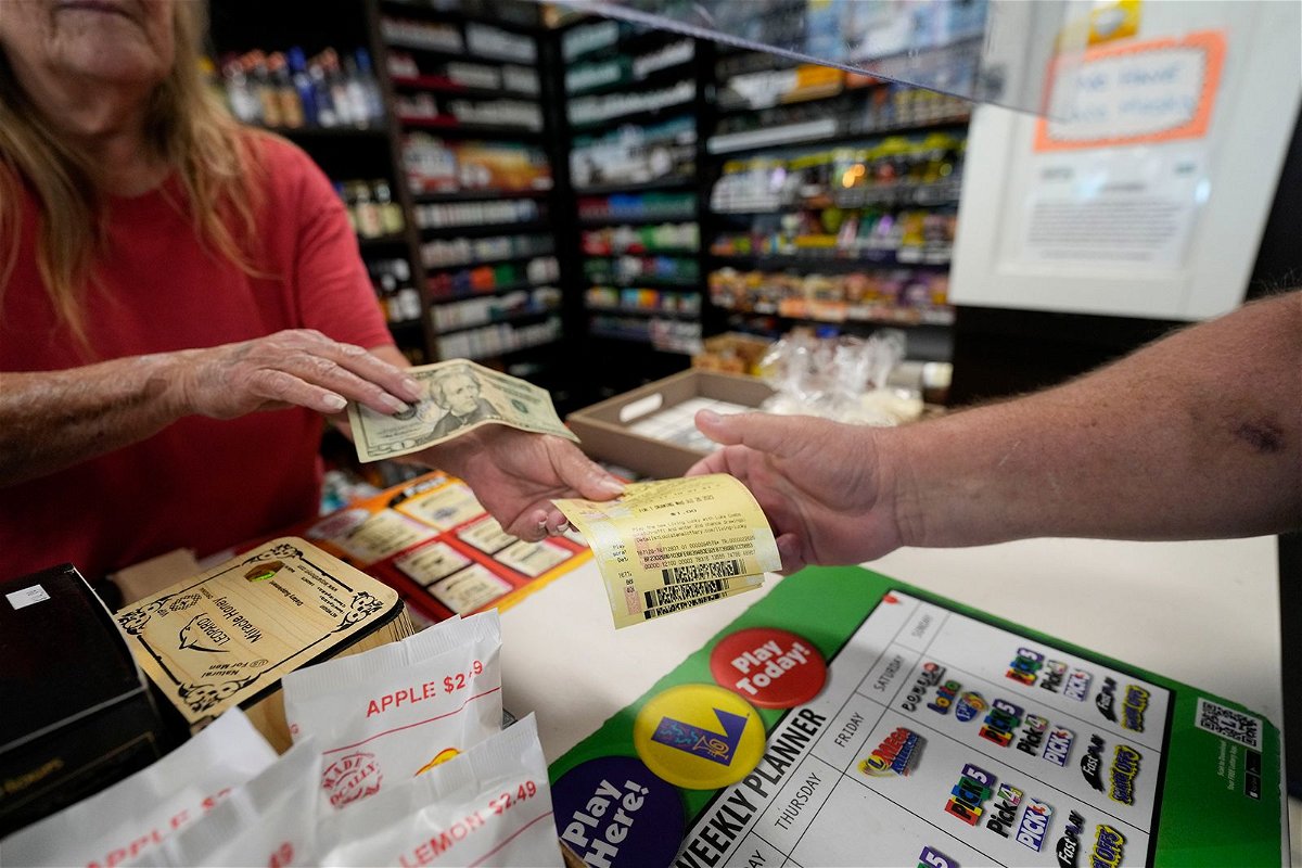 <i>Gerald Herbert/AP</i><br/>A cashier sells tickets for the Mega Millions lottery in Harahan