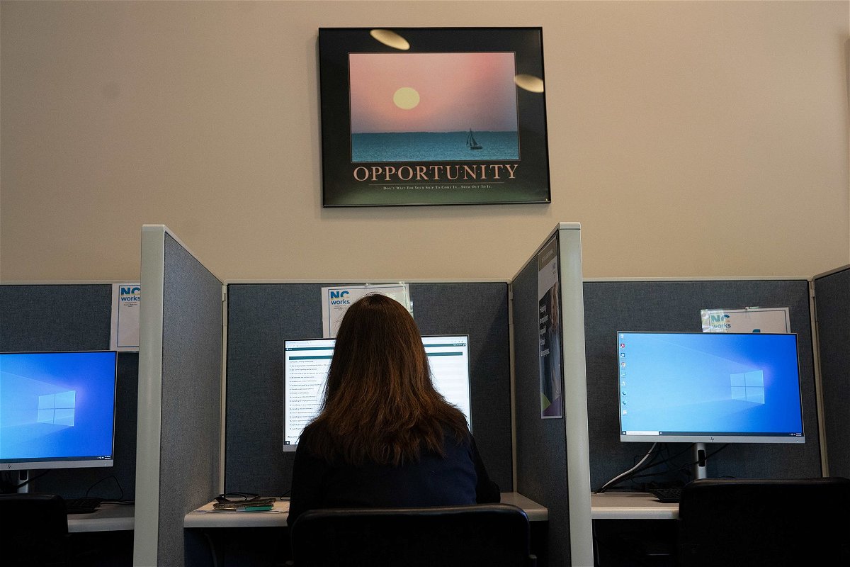<i>Allison Joyce/Bloomberg/Getty Images</i><br/>An attendee fills out job applications at a Novant Health Career Fair at NC Works in Wilmington