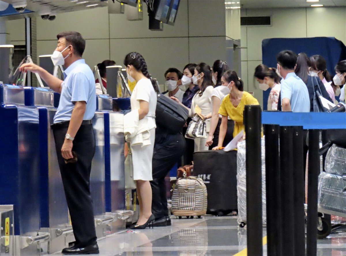 Passengers prepare to board an Air Koryo plane bound for Pyongyang at Beijing Capital International Airport on Aug. 26.
