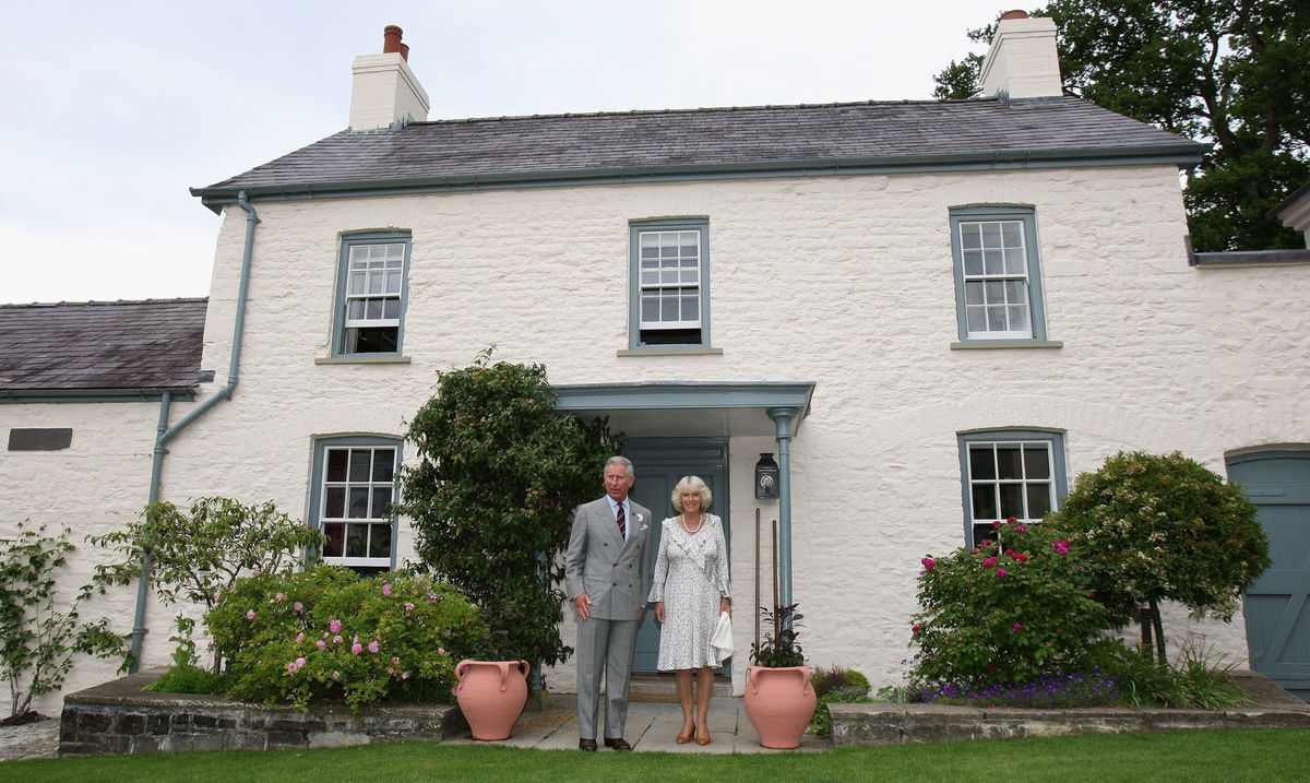 The royal residence you might soon be able to rent. King Charles and Queen Camilla pose outside their Welsh property Llwynywermod in 2019.