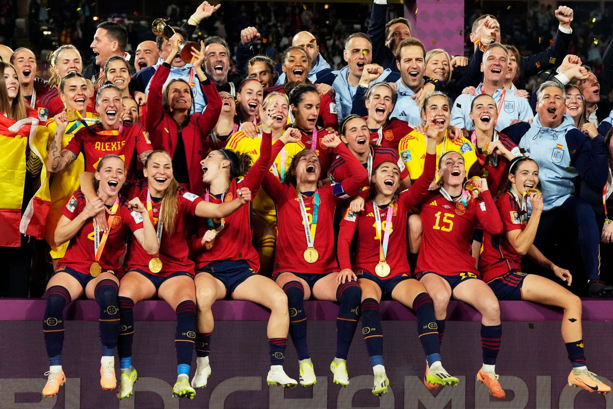 <i>Rick Rycroft/AP</i><br/>Spain's team celebrate with the trophy after winning the final of the Women's World Cup.