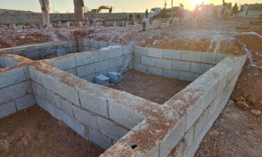 Graves are dug at the Tartoba cemetery outside Derna