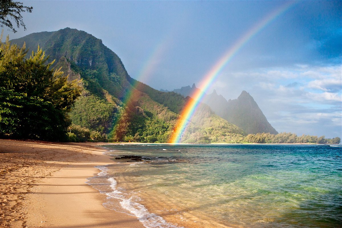 Travel adviser Marilyn Clark, a Hawaii specialist, usually visits the state in the fall after the summer crowds have gone. It's a good time to see rainbows, like this double stunner at Tunnels Beach on Kauai.
